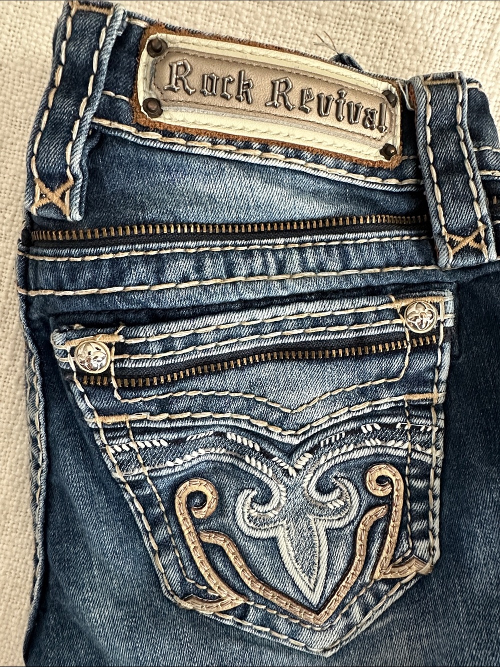 Rock Revival Women's Distressed Blue Boot Cut Jeans with Embroidered Pockets